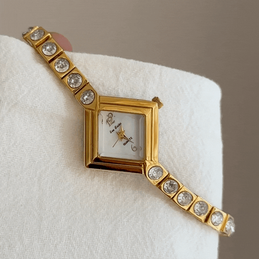 Elegant Gold Bracelet Watch with Diamond-Accented White Rhombus Dial – Women’s Quartz Watch