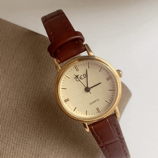 Elegant Women’s Quartz Watch – Brown Leather Strap with Gold Round Case and Airplane Second Hand