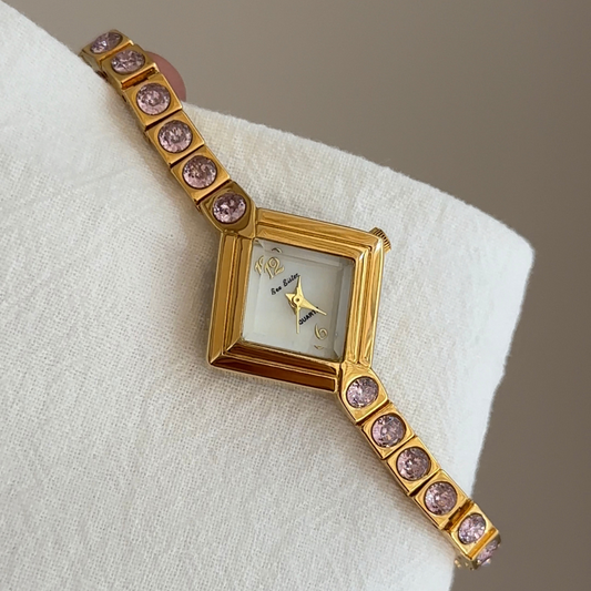 Elegant Gold Bracelet Watch with Pink Diamond Accents & White Rhombus Dial – Women’s Quartz Watch