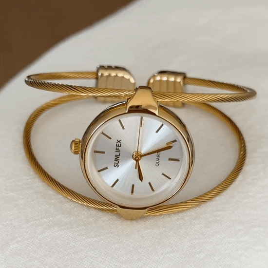 gold open bangle watch white dial