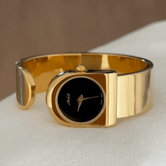 gold wide cuff watch black dial women  