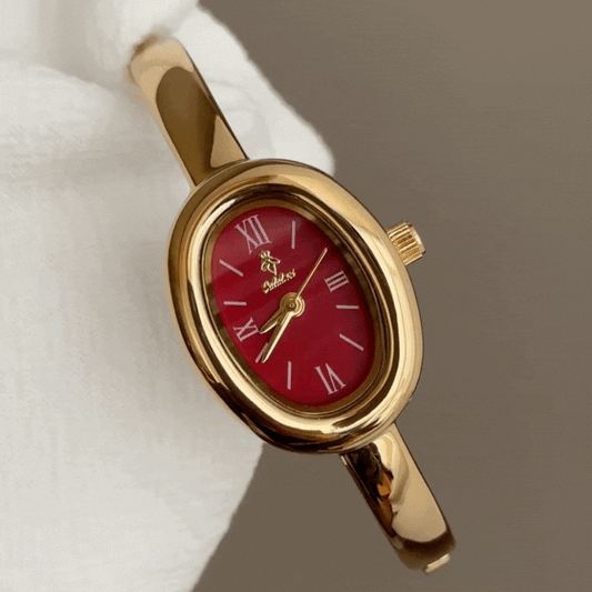 vintage gold bracelet watch red face
