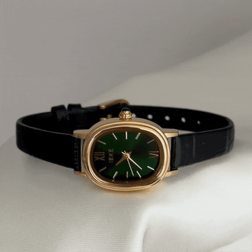 Understated Elegance Black Oval Gold Case Genuine Leather Quartz Watch