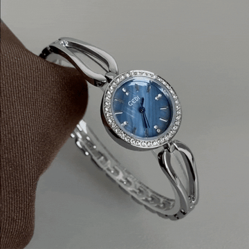 Elegant Silver Bangle: Blue Dial Quartz Watch