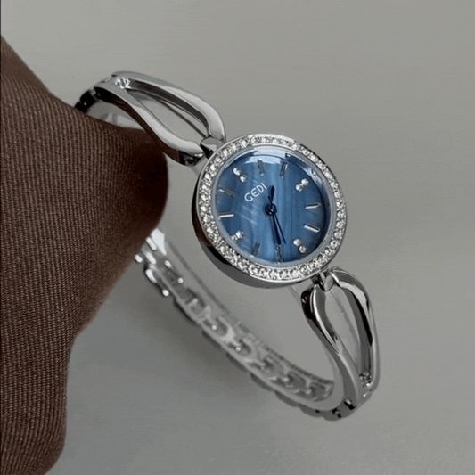 Elegant Silver Bangle: Blue Dial Quartz Watch