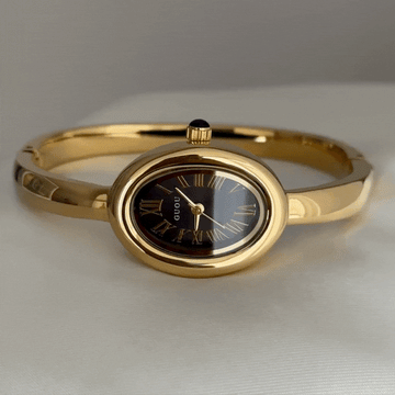 Noir Éclat – Women’s Gold Bangle Quartz Watch with Black Tonneau Dial