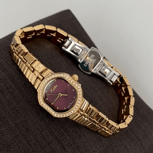 Feminine Luxury: Red Round Dial Watch with Gold Diamond Bezel & Stainless Steel Bracelet