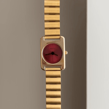 Sculptural Chic: Red Round Dial Watch with Gold Rectangular Bezel & Bamboo-Pattern Stainless Steel Bracelet