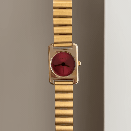 Sculptural Chic: Red Round Dial Watch with Gold Rectangular Bezel & Bamboo-Pattern Stainless Steel Bracelet