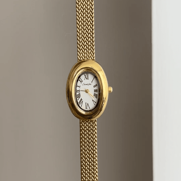 Sophistication Elegant: White Oval Dial Watch with Gold Wheat Pattern Stainless Steel Bracelet