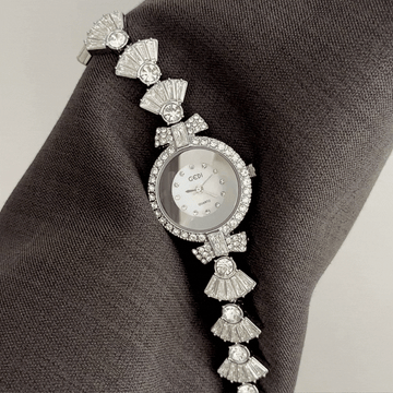 Feminine Glamour: White Round Dial with Diamond-Set Silver Bezel & Diamond Bow Strap