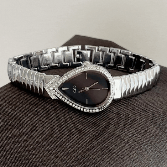 Bold Artistry: Black Teardrop Serpent-Head Dial with Silver Diamond Bezel & Strap
