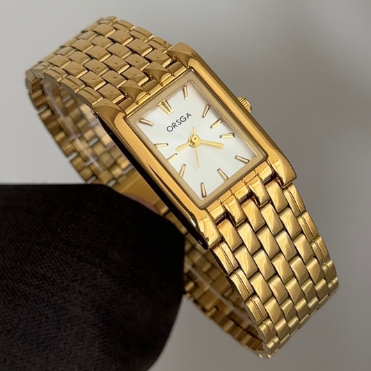 Defining Luxury Minimalism: A White Rectangle Dial with Gold Bezel & Bracelet