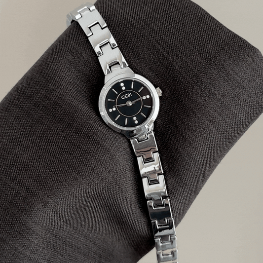 Modern Classic: Black Round Dial with All-Silver Bracelet