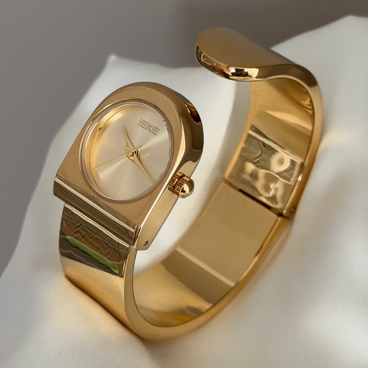 Statement Boldness: Luxurious Gold Round Dial Watch with Gold Cuff Bracelet