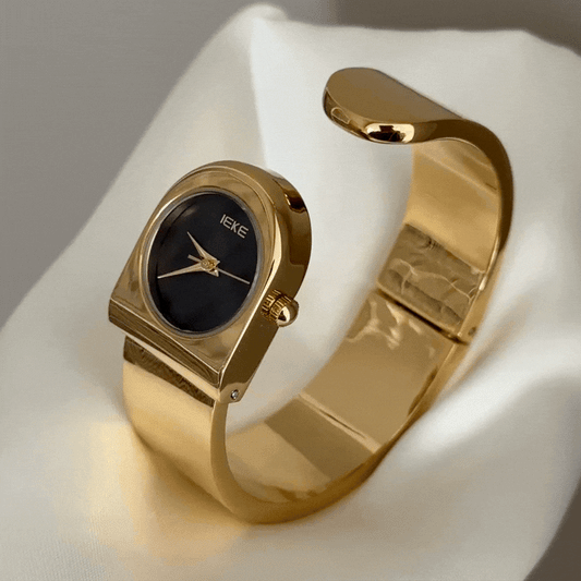 Bold Sophistication: A Study in Contrasting Elegance – Noir Round Dial & Statement Gold Cuff