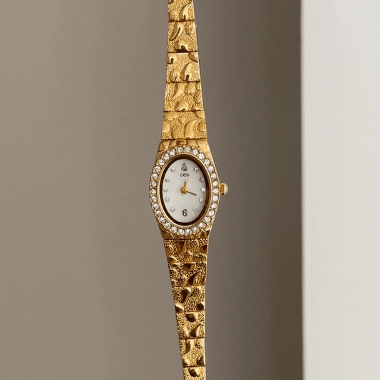 Gilded Grace: White Oval Dial Watch with Gold Diamond Bezel & Alloy Bracelet