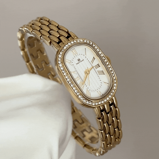 Luxurious Glamour: White Oval Dial Watch with Gold Diamond Bezel & Steel Bracelet