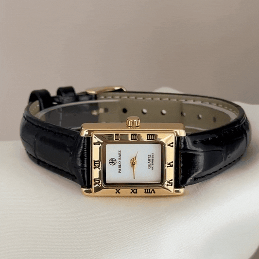 Contemporary Classic: White Rectangular Dial Watch with Gold-Tone Bezel & Black Leather Strap