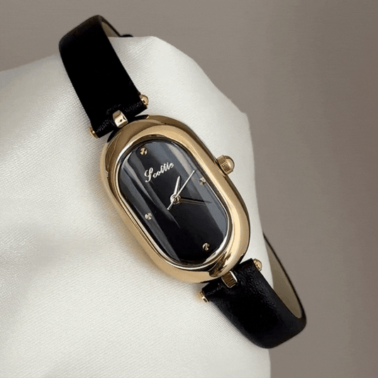 Sophisticated Contrast: Black Oval Dial with Gold Bezel & Black Leather Strap