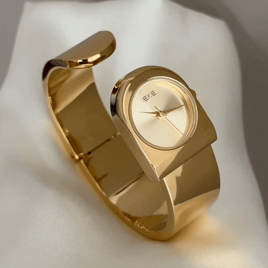 Statement Boldness: Luxurious Gold Round Dial Watch with Gold Cuff Bracelet