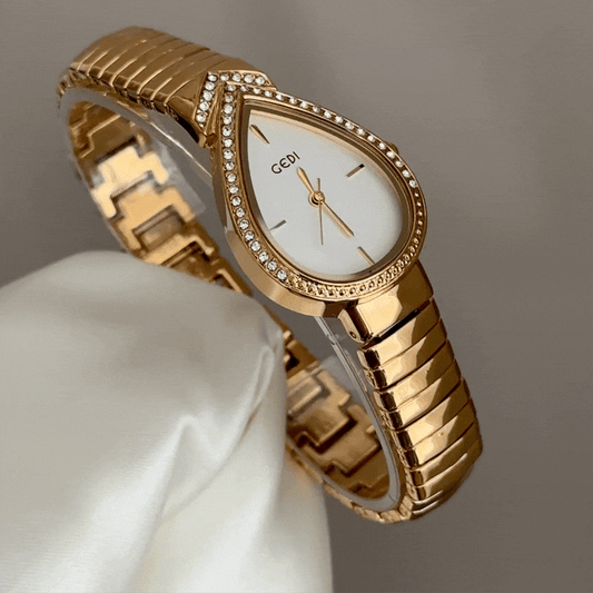 Feminine Artistry: White Teardrop Serpenti Dial with Gold Diamond Bezel & Strap