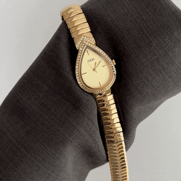 Opulent Symbolism: Gold Teardrop Serpenti Dial with Gold Diamond Bezel & Strap