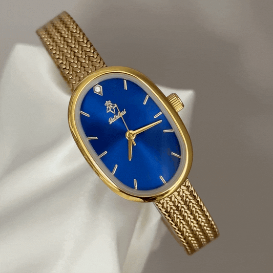 Warm Sophistication: Navy Oval Dial Watch with Gold Oval Bezel & Gold Wheat Pattern Bracelet