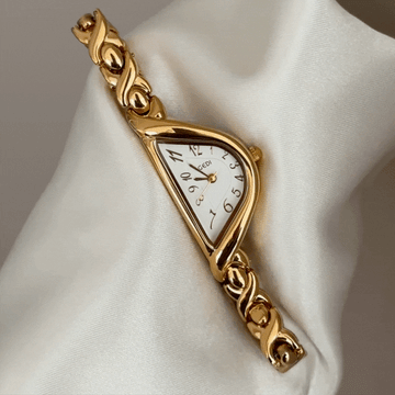 Curved Elegance: White Half-Round Dial & Gold-Tone Bracelet Watch