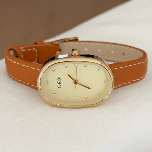 Elegant Golden Mother-of-Pearl Oval Dial Orange Vegan Leather Strap Quartz Watch
