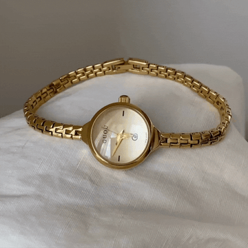 gold bracelet watch round dial