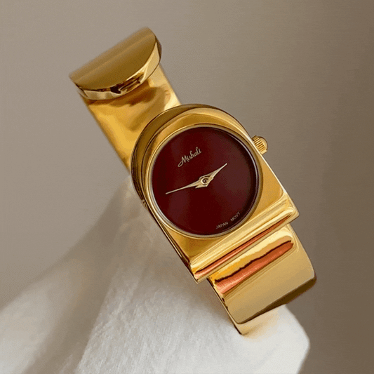 gold bracelet watch red round dial