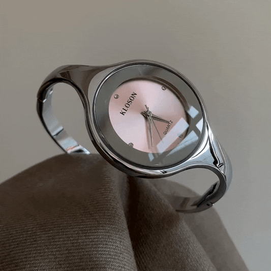 silver bangle watch with pink dial