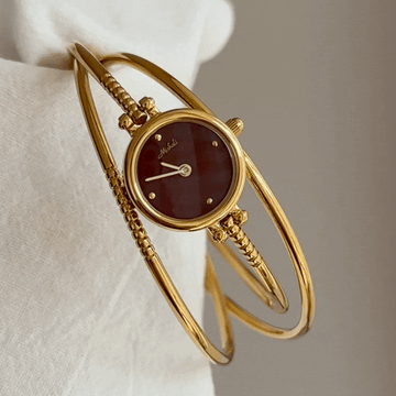 multi layer gold bangle watch red dial