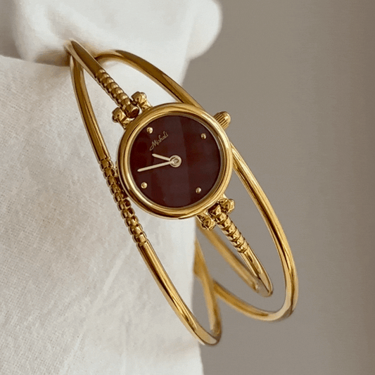 multi layer gold bangle watch red dial